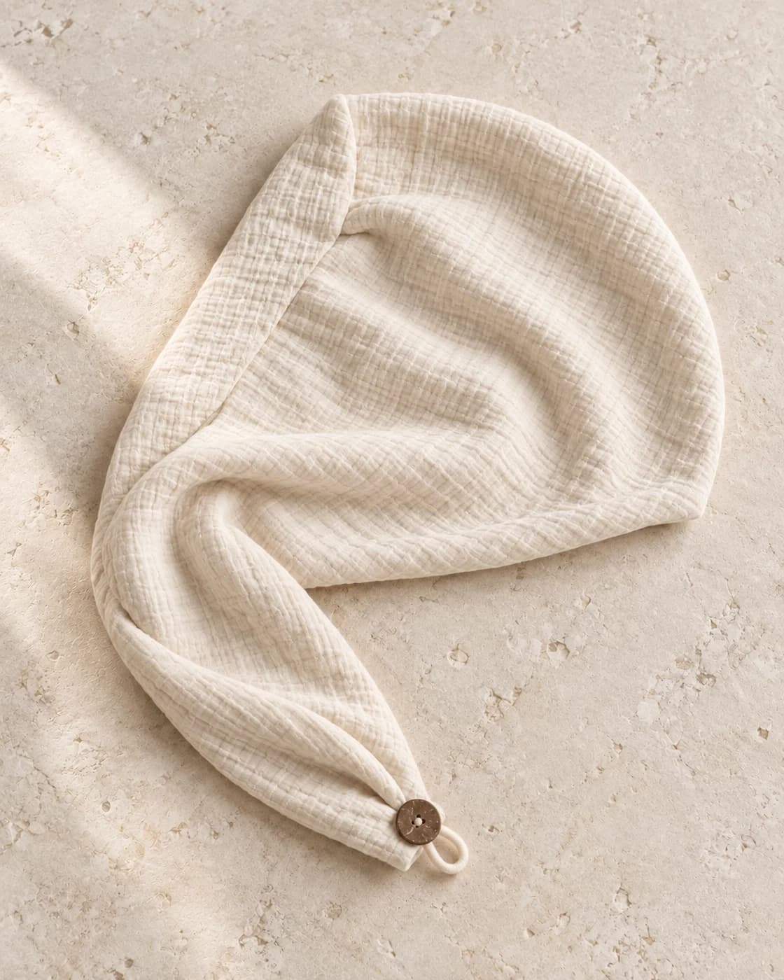 the hair wrap in ivory, showing its texture and finish